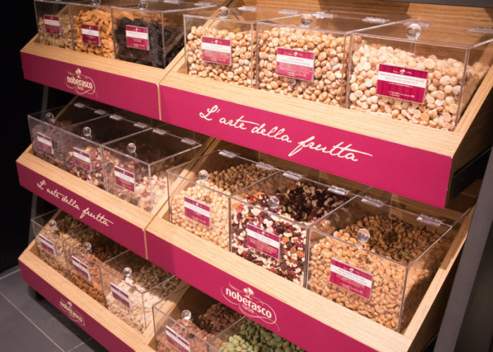Noberasco Dried Fruit ROME, ITALY - DECEMBER 30, 2017: Dried fruit of Noberasco at food market inside the new La Rinascente shopping mall in via del Tritone. Noberasco is an Italian leader in the dried fruit market.